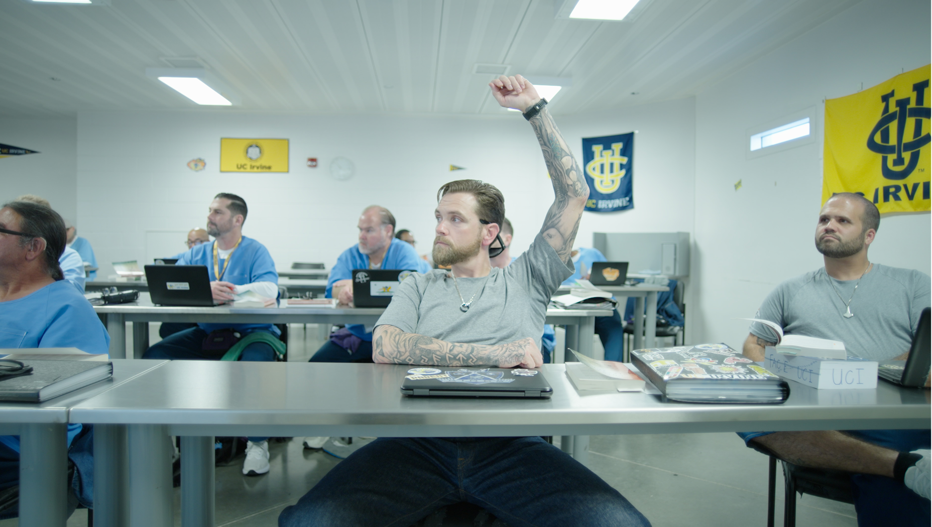 A student in the LIFTED program has his hand up in the classroom.