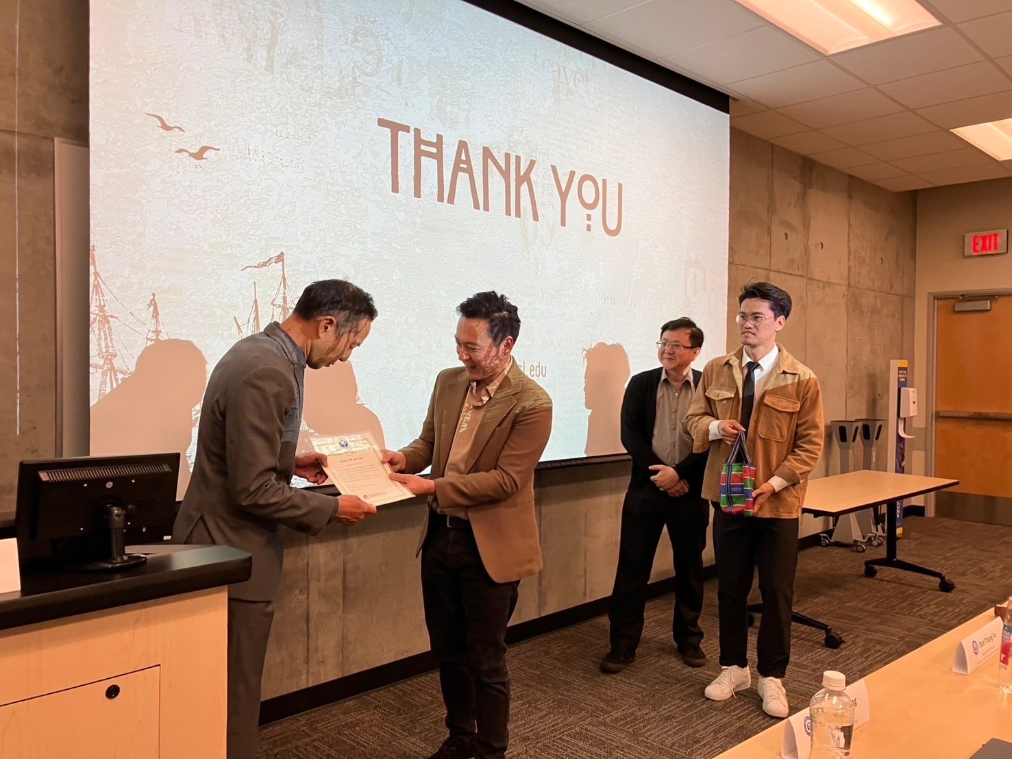 UC Irvine's Global Languages & Cultures and NTUST representatives shaking hands