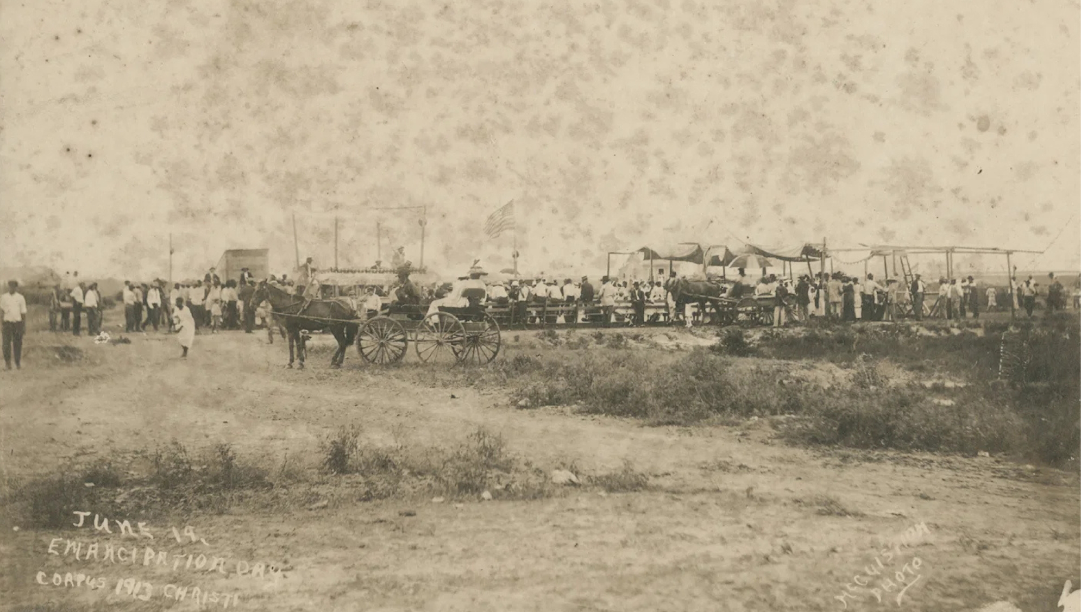 June 19, Emancipation Day. Corpus Christi, 1913. Image of a group gathered in and around a grandstand for Juneteenth celebrations.